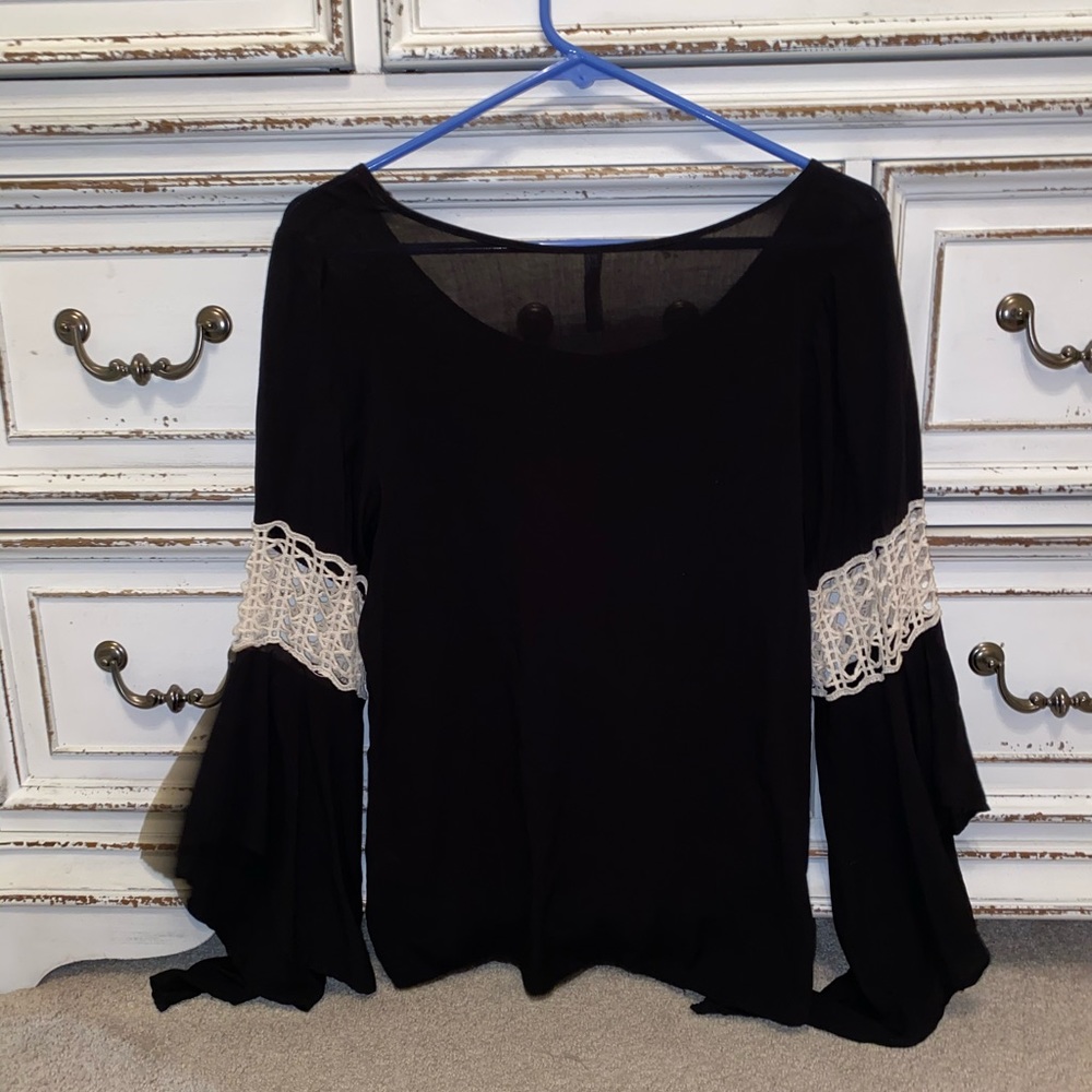 black shirt with flared sleeves
